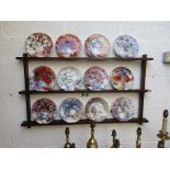 Set of 12 Wedgwood plates with wall rack