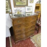 Bow fronted walnut chest of 5 drawers