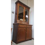 Very tall glass-fronted cabinet