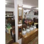 Pair of oak-framed & bevelled mirrors