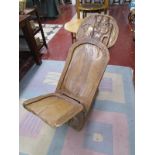 Carved, African birthing chair
