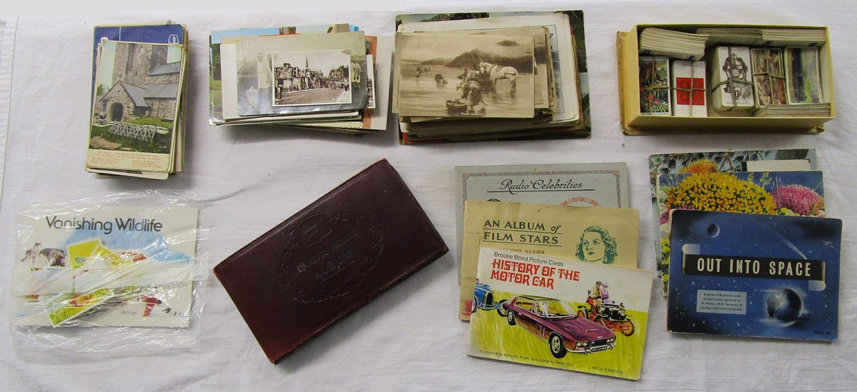 Tin of cigarette card albums, old postcards & maps