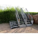 Pair of very large wooden stage steps and a smaller pair