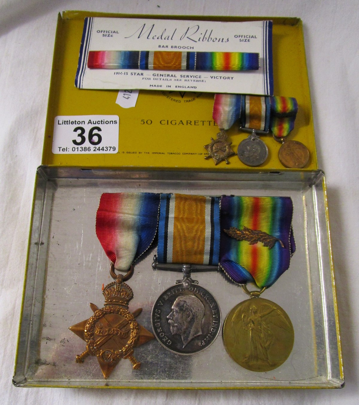 Trio of medals with mess uniform miniatures