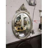 Ornate wall mirror with candle sconces