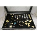 Display case of costume jewellery to include rings & brooches