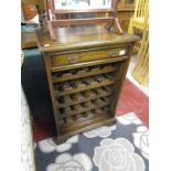 Oak wine cabinet with drawer