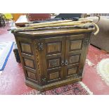 Carved and panelled oak cabinet