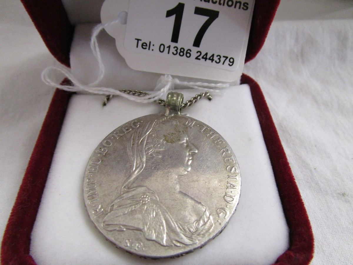 Silver coin pendant on chain