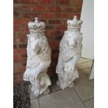 Pair of stone sitting lions