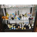 Collection of Avon scent bottles over 2 shelves