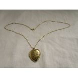 Gold back & front heart shaped locket on chain