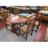 Oak extending dining table and 4 ladder back chairs