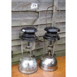 2 hurricane lamps