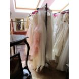 Rack of approx 40 quality wedding dresses etc