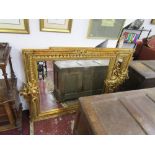 Pair of ornate gilt framed & bevelled glass wall mirrors