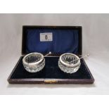 Pair of silver mounted glass salts with spoons