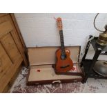 Acoustic guitar in case
