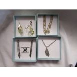 4 pieces of decorative boxed costume jewellery