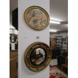 Small convex mirror and oval print