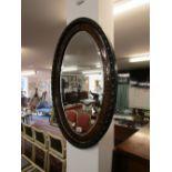 Oval bevelled glass wall mirror