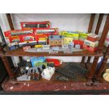 2 shelves of Model railway track, carriages, engines etc to include Hornby
