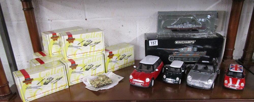 Shelf of model diecast cars and tanks etc