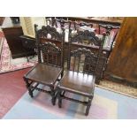 Pair of early oak hall chairs