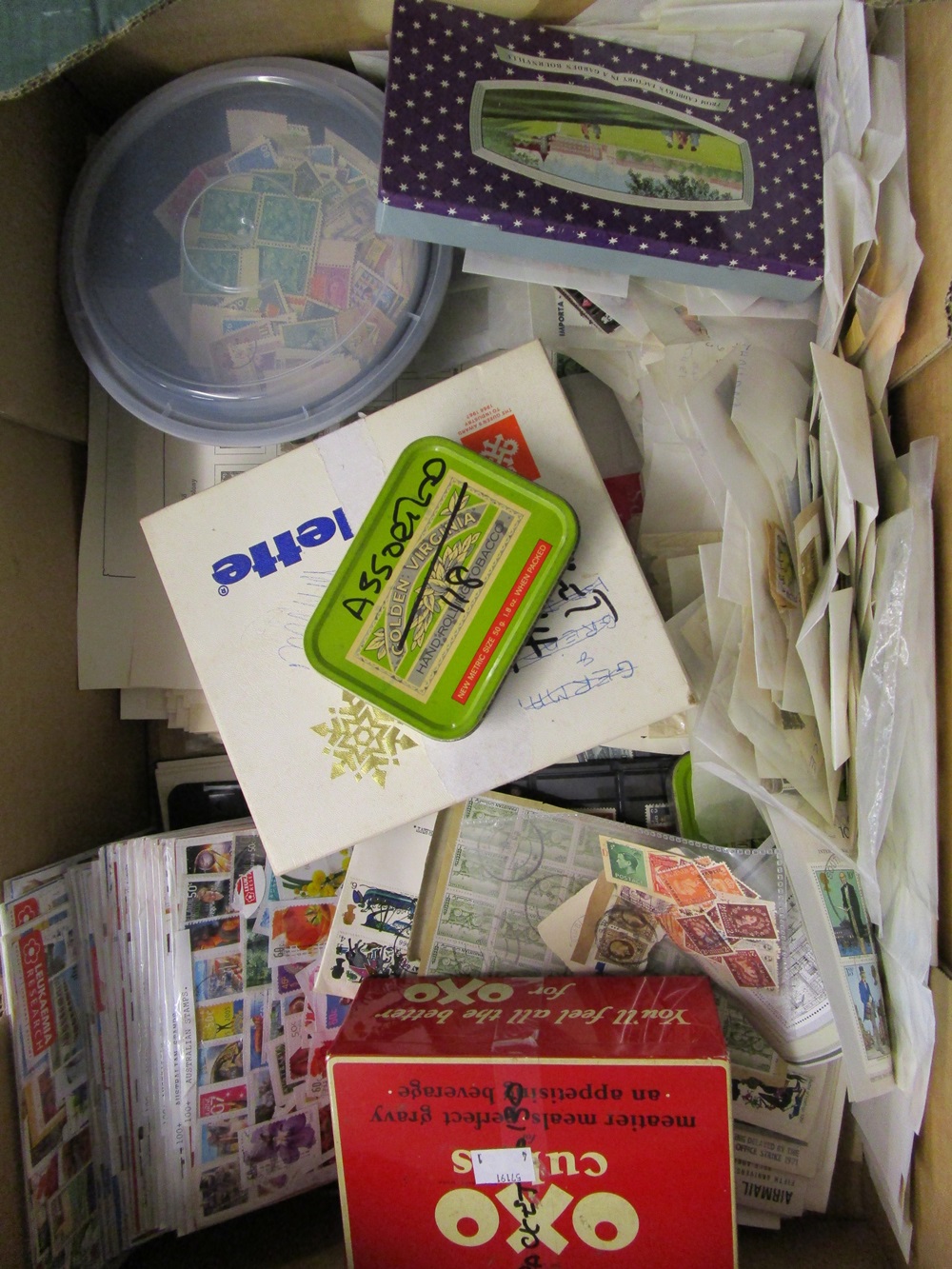 Stamps - Large glory box of World & Commonwealth stamps in packets, tins, albums pages etc