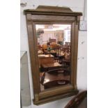 Framed wall mirror with copper tint