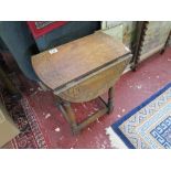 Small carved drop leaf table