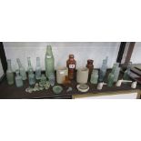 Shelf of vintage glass & ceramic bottles etc