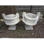 Pair of pedestal stone planters