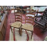 Pair of oak ladder-back chairs