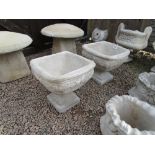 Pair of pedestal stone planters