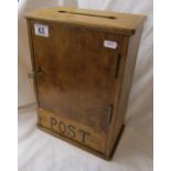 Old wooden post letter box