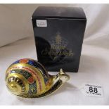 Boxed Royal Crown Derby Snail paperweight with gold stopper