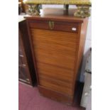 Oak tambour front stationary cabinet