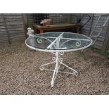 Circular metal and glass garden table