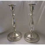 Pair of weighted silver candlesticks - H: 27cm