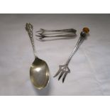 Silver spoon, fork and sugar nips