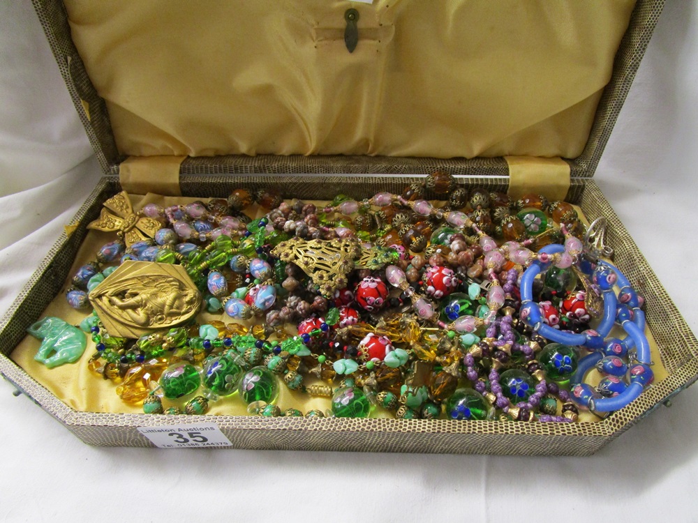 Case of various necklaces (all knotted)