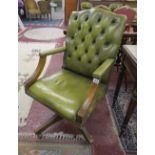 Green button-back leather office armchair