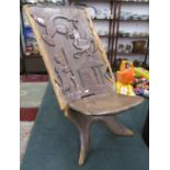 Unusual carved African birthing chair