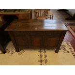 Early oak coffer with carved front