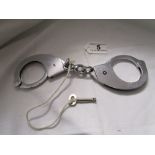 Pair of 1960's Hyatt's police cuffs with key