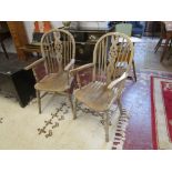 Pair of elm seated wheelback armchairs