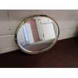 Oval metal framed mirror