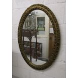 Oval gilt framed wall mirror