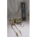 2 silver serviette rings, sugar nips & butter knife